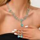 woman wearing blue jewelry set