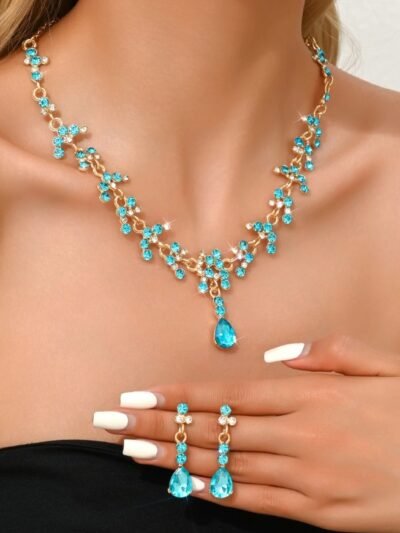 woman wearing blue jewelry set