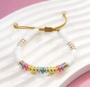 colorful boho bracelet on a white desk