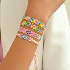 woman wearing colorful bracelets set and a white blouse