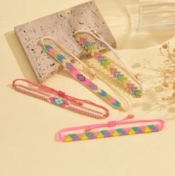 front view of colorful bracelets set on the beige table