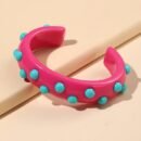 pink variation of colorful cuff bracelet on the beige backround