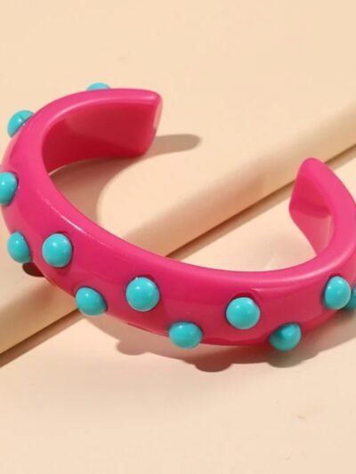 pink variation of colorful cuff bracelet on the beige backround