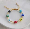 colorful evil eye bracelet on a white surface
