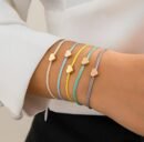 woman wearing colorful rope bracelets on her wrist