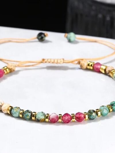 front view of colorful stone bracelet on the white table