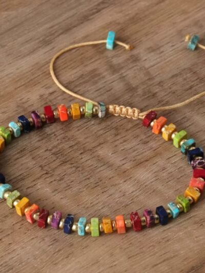 front view of multicolor imperial bracelet on the wooden table