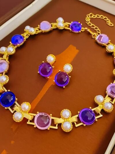 purple jewelry set on a wooden surface
