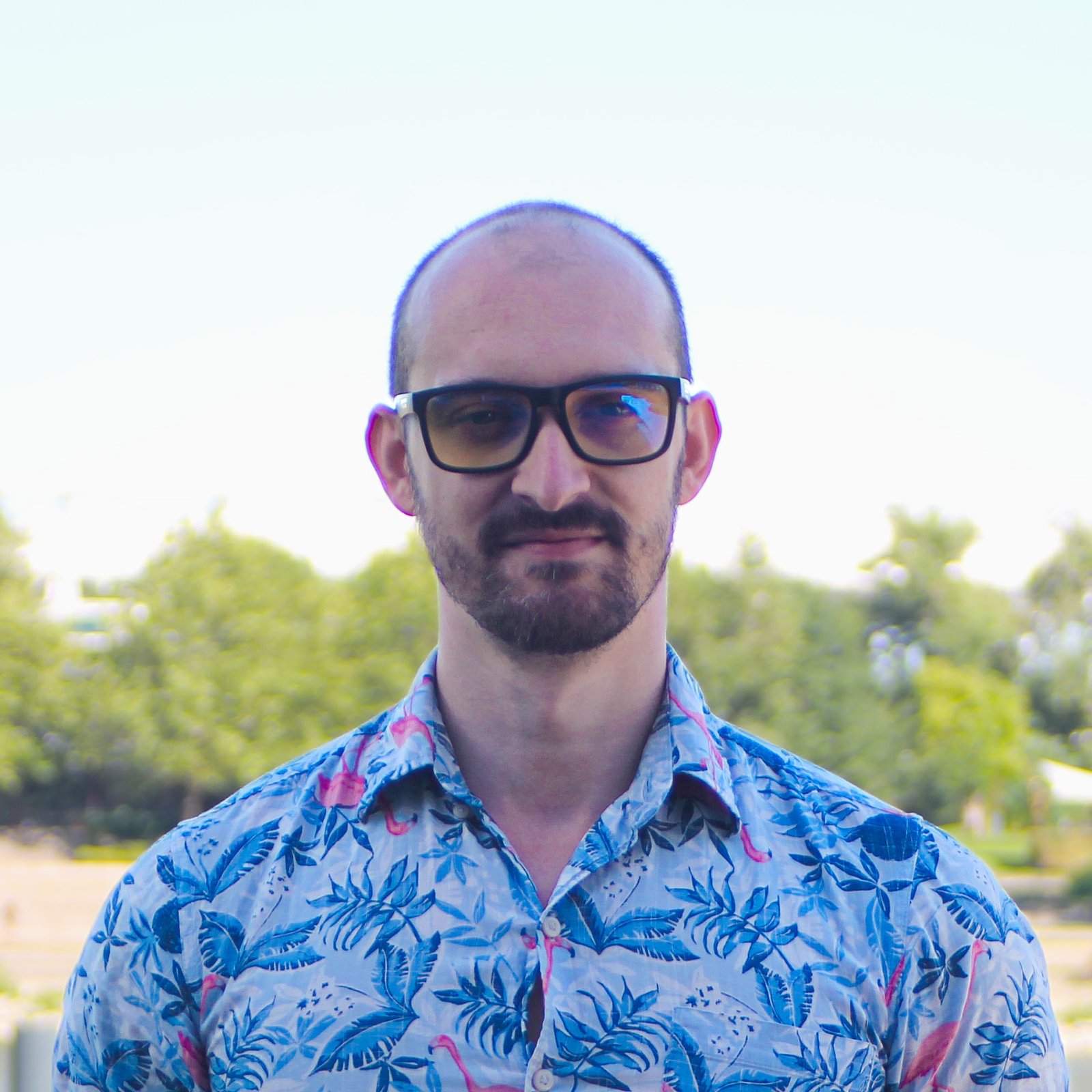 tech worker, man standing in blue flamingo shirt