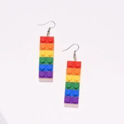 colorful building block earrings on the white background
