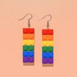 colorful building block earrings on the orange backgorund