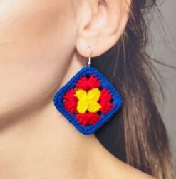 woman wearing colorful crochet earrings