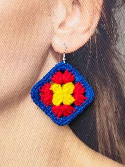 woman wearing colorful crochet earrings