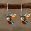 colorful earrings for women hung on a wooden branch
