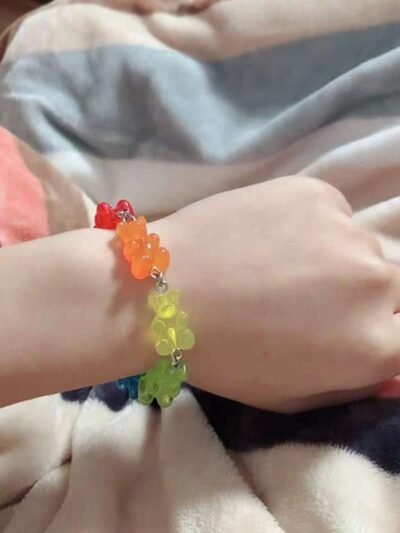 woman wearing colorful gummy bear bracelet