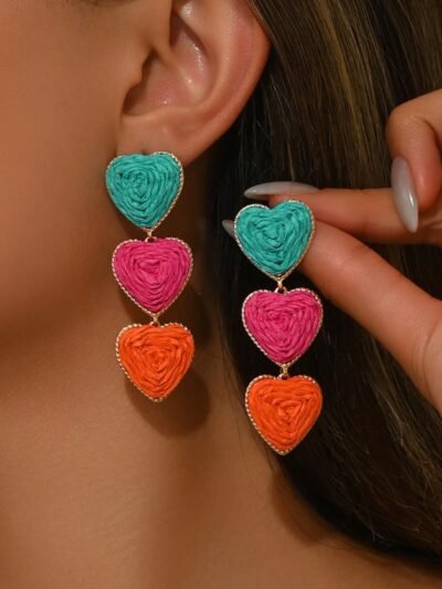 woman wearing colorful heart-shaped earrings