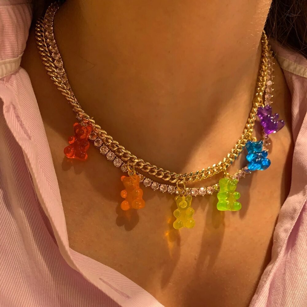 woman wearing colorful necklace and a pink shirt