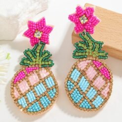 colorful pineapple earrings on the white table