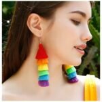 woman turned to her side wearing colorful tassel earrings