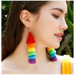woman turned to her side wearing colorful tassel earrings