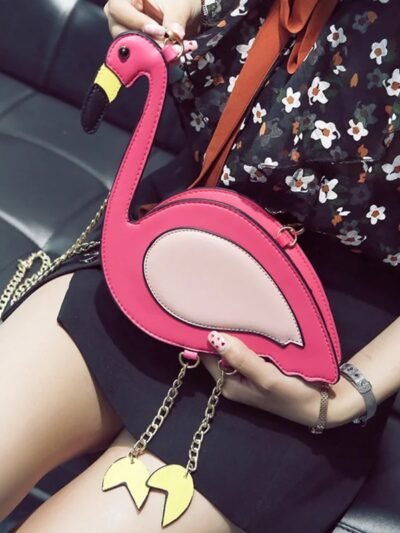 woman wearing flamingo bag, black shorts and black floral shirt