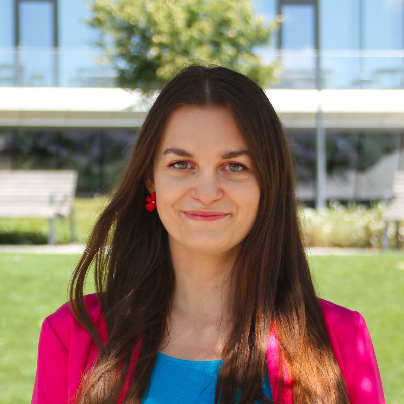 founder of store, woman standing in pink blazer