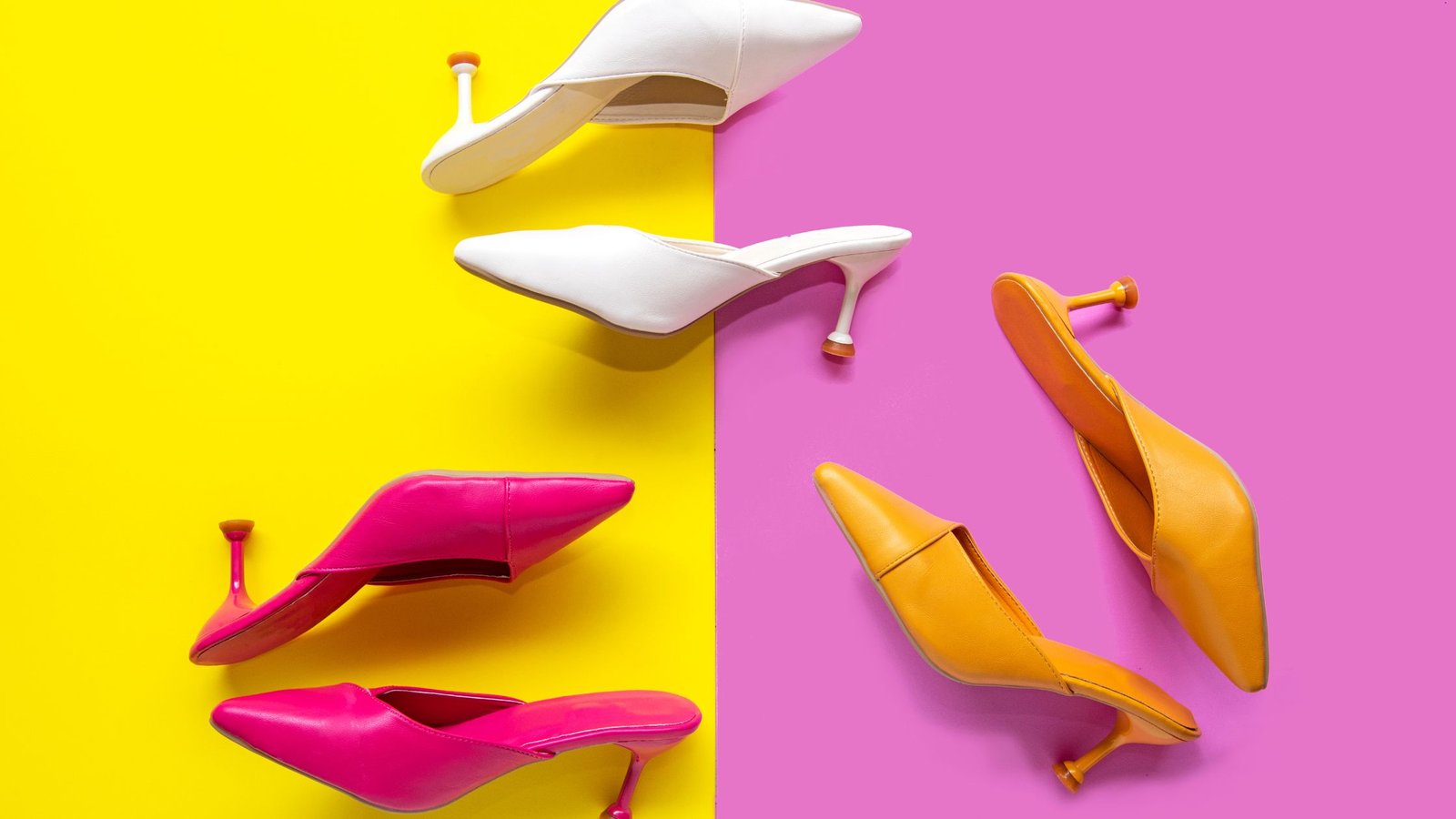 colorful shoes including pink heels, orange heels and white heels on the yellow and pink background