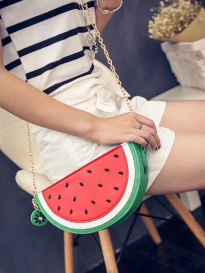 woman wearing watermelon bag, white shorts and striped shirt