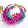 colorful coral necklaces on the white table