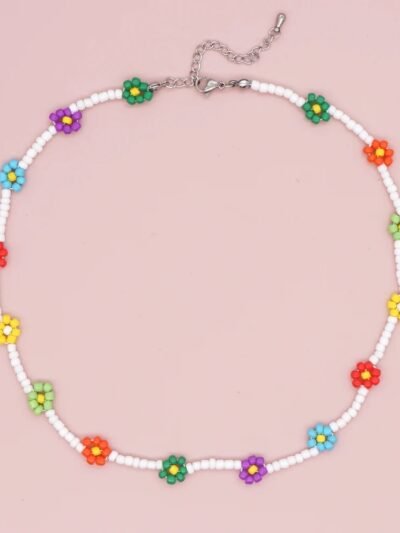 colorful floral necklace on the blush pink background