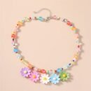 colorful necklace with flowers on the beige background