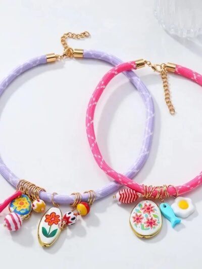 front view of colorful rope necklaces on the white background