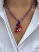 woman wearing colorful seahorse necklace