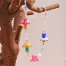 waterproof colorful necklace on the wooden branch