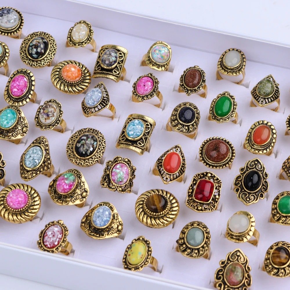 colorful rings in a white jewelry box