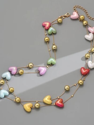 romantic colorful necklace arranged on the grey background
