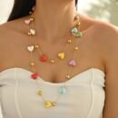 woman wearing romantic colorful necklace and a white top