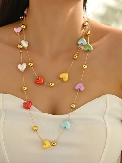 woman wearing romantic colorful necklace and a white top