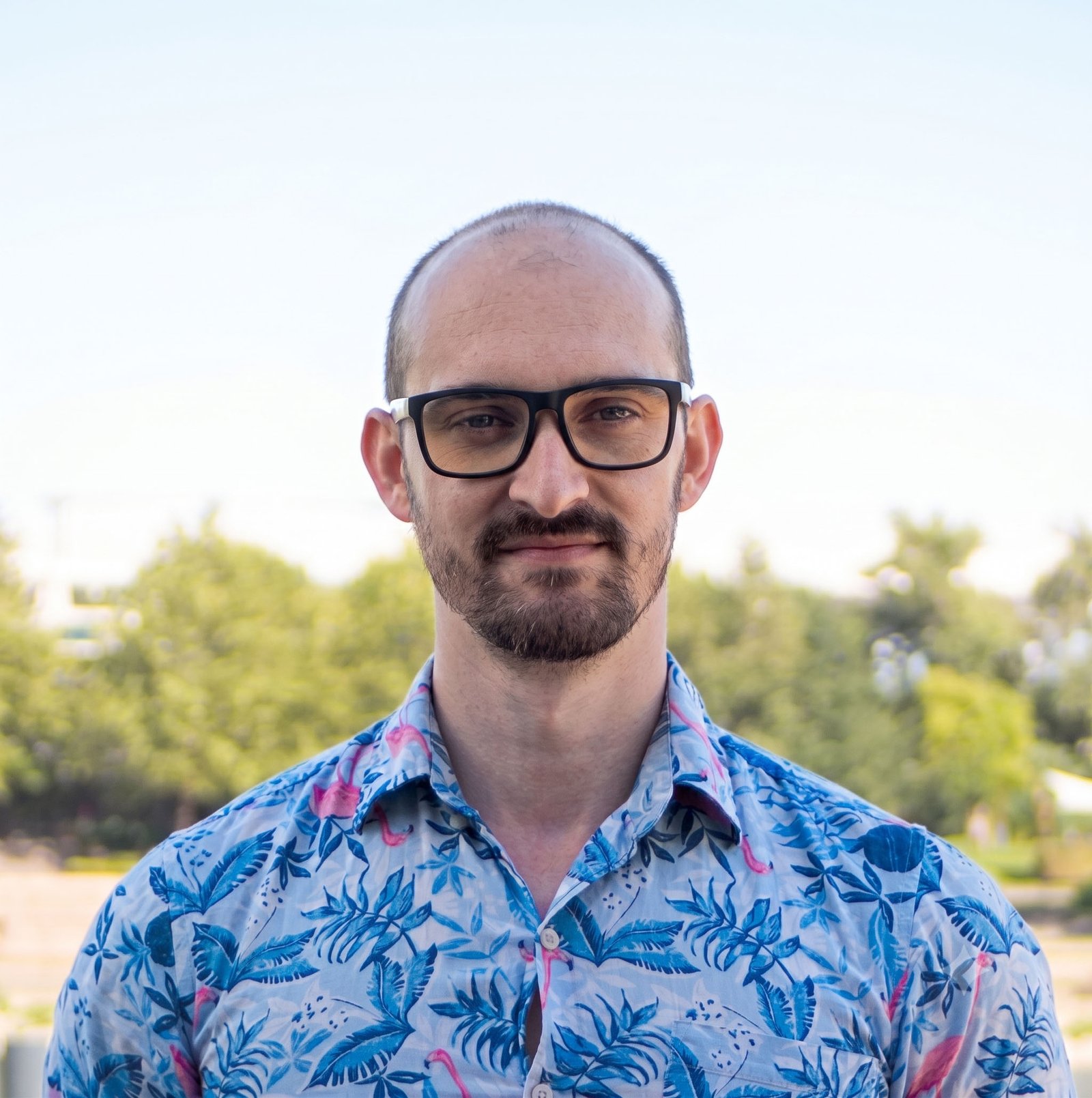 tech worker, man standing in blue flamingo shirt